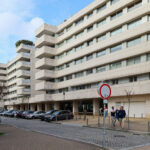 Alcino Soutinho’s Quinta das Sedas featuring a high-rise mixed-use condominium with concrete and composite materials, showcasing urban design elements and a modern commercial building façade.