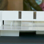 Gonçalo Byrne’s "6 Unbuilt Villas, Lot 209" scale model showcasing transparent composite materials and detailed interior design with visible flooring elements.