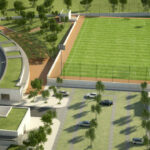 Álvaro Siza Vieira’s Commercial Area, Lot 156 showcasing a bird's-eye view of a sports venue with artificial turf, landscaped lawns, and stadium structures within a campus setting.