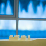 Manuel Aires Mateus’s 7 Architectural Townhouses and 11 Architectural Villas, Lot 143, showcasing minimalist design with sharp geometric forms, textured plastic surfaces, and dynamic shadow play across the façades.