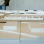 Nuno Graça Moura’s design of the 30 Architectural "Bar Code 1" Townhouses, Lot 152, showcasing a modern arrangement of linear townhouse units with distinctive vertical elements and a sleek, minimalist façade.