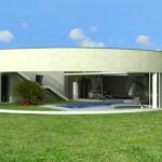 Manuel Graça Dias and Egas José Vieira’s 13 Architectural Round Houses, L333, showcasing circular concrete structures with landscaped yards featuring artificial turf, shaded garden areas, and modern villa elements.