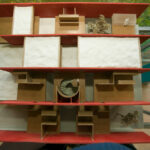 Gonçalo Byrne’s design for "6 Unbuilt Villas, Lot 209" showcasing interior wood shelving with plywood and hardwood elements finished with varnish and wood stain.