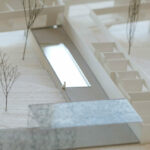 Carrilho da Graça’s 14 Architectural Villas, Lot 190, showcasing minimalist white façades with clean lines and large windows integrated into a natural landscape.