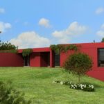 Luísa Penha’s 9 Architectural Villas, Lot 297, showcasing modern farmhouse design with landscaped gardens, expansive lawns, and a spacious backyard yard.