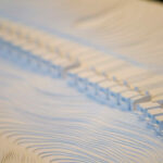 Gonçalo Cardoso de Menezes’ 21 Architectural Townhouses, Lot 154, showcasing a repetitive pattern of modern geometric façades with clean lines and integrated glass elements.