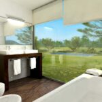 Eduardo Souto de Moura’s 10 Architectural "Hilltop" Villas, Lot 113, showcasing modern interior design with sleek flooring, minimalist furniture, high ceilings, shaded areas, and integrated plumbing fixtures in a resort-style home.