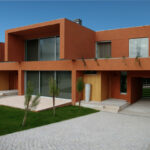 Atelier dos Remédios, Madalena Cardoso de Menezes, and Francisco Teixeira Bastos’ 18 Red Architectural Townhouses, Lot 215, showcasing a residential complex with concrete façades, balconies, shaded courtyards, and daylighting elements.