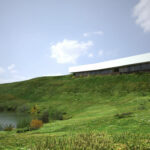 Nuno Graça Moura’s Golf Clubhouse featuring a modern design with large glass façades overlooking a surrounding grassland and meadow landscape.